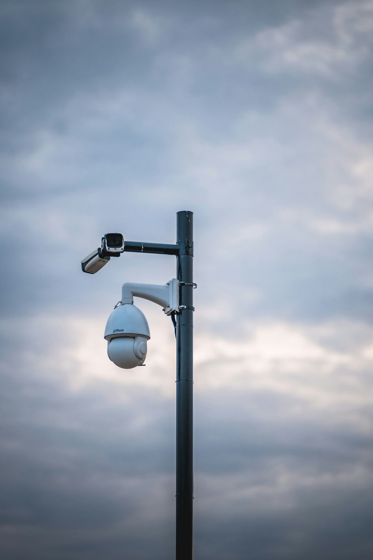 a street light with a camera attached to it